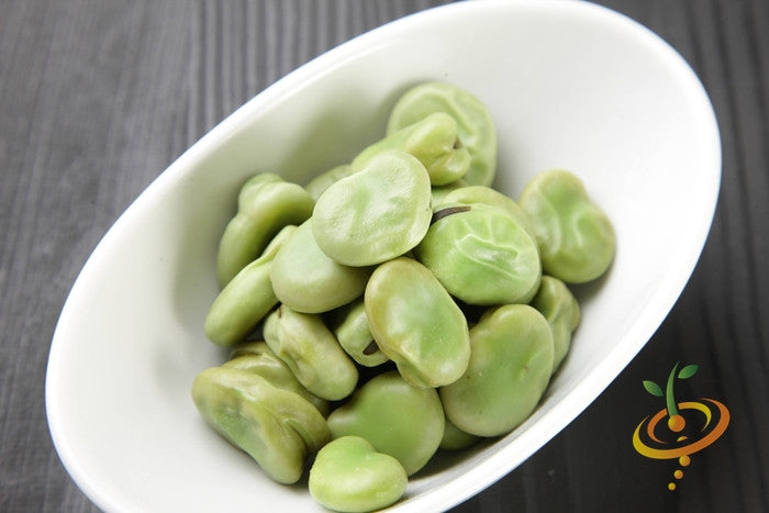 King of the Garden lima beans in white bowl on dark wooden surface