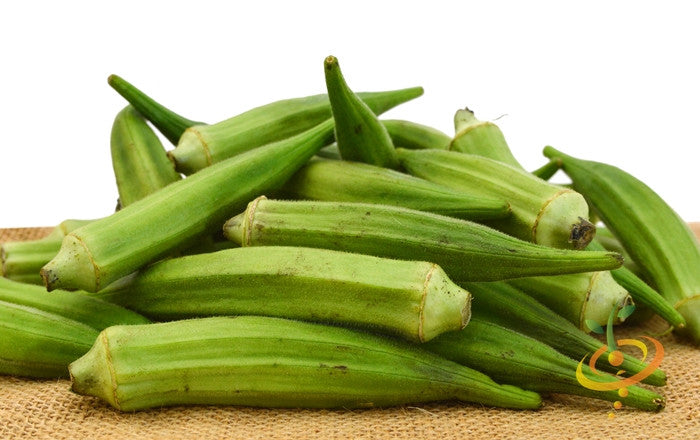 Fresh green Okra Clemson Spineless pods stacked on burlap background